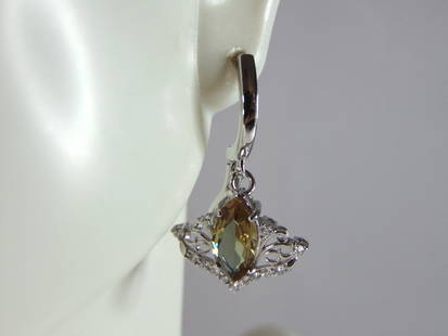 Womens Estate Sterling Silver Citrine Dangle Earrings: A PAIR OF WOMENS ESTATE STERLING SILVER CITRINE COLORED DANGLE EARRINGS. EARRINGS WEIGH 4.2g AND MEASURES 1 1/8" LONG BY 5/8" WIDE. ANY OTHER QUESTIONS, PLEASE DO NOT HESITATE TO ASK. BE SURE TO CHECK