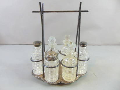 Silver Plated Cruet Set by Thomas Bradburn & Sons: FOR SALE IS THIS VINTAGE ANTIQUE SILVER PLATE CRUET SET BY THOMAS BRADBURY & SONS. IT IS A 6 PIECE SET WITH CADDY. CADDY MEASURES 10 1/2" BY 8 5/8".COULD BE A CRUET SET OR PERFUME SET. PIECE IS STAMPE