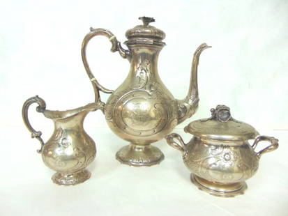 ANTIQUE VICTORIAN AESTHETIC GERMAN COIN SILVER TEA SET: A BEAUTIFUL ANTIQUE VICTORIAN AESTHETIC GERMAN COIN SILVER TEA SET THAT WAS MADE BY H. STEENAERTS. TOTAL WEIGHT OF THE SET IS 1568g. THE TEAPOT MEASURES 11" TALL BY 10" LONG. CONDITION IS GOOD FOR ITS