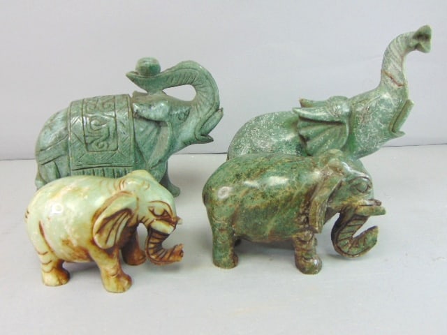 Lot of Four Vintage Decorative Soapstone Elephants: THIS LOT OF VINTAGE ESTATE DECORATIVE SOAPSTONE ELEPHANTS INCLUDES 4 PIECES. 3 ELEPHANTS ARE SOAPSTONE AND ONE IS JADE. THE JADE ELPHANT MEASURE 3 1/8" TALL BY 4 1/4" WIDE, THE OTHER THREE MEASURE 6 3