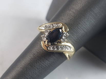 Womens Vintage Estate 14k Yellow Gold Sapphire & Diamond Ring: A WOMENS VINTAGE ESTATE 14K GOLD RING, WITH BEAUTIFUL SAPPHIRE STONES AND DIAMONDS. . THE SIZE OF THE RING IS A 7.0. RING WEIGHS 3.7g AND THERE ARE ABOUT .12cts OF DIAMONDS. THE SAPPHIRE IS ABOUT 0.50