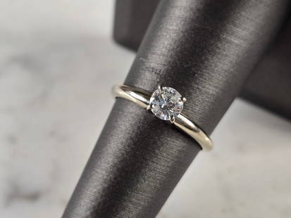 Womens Vintage Estate 14k White Gold Diamond Engagement Ring: A WOMENS VINTAGE ESTATE 14K WHITE GOLD DIAMOND RING THAT WEIGHS 2.2g. THE SIZE OF THE RING IS A 7.0, AND IS ABOUT 3/16" WIDE. THE DIAMOND IS ABOUT 0.40cts. DIAMOND DOES HAVE SOME FLEA BITES ALONG THE
