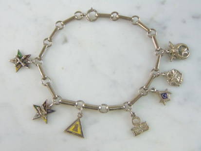 Womens Vintage Estate Sterling Silver Charm Bracelet: A WOMENS VINTAGE ESTATE STERLING SILVER CHARM BRACELET. THE BRACELET MEASURES 7 1/2" LONG BY 1/4" WIDE AND WEIGHS 11.9g. IF ANY QUESTIONS, PLEASE DO NOT HESITATE TO ASK. THIS MAKES A GREAT GIFT FOR TH