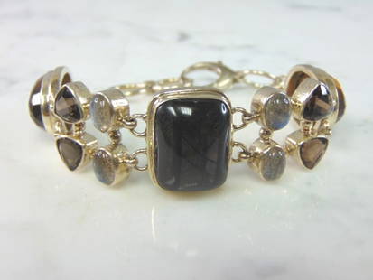 Womens Vintage Sterling Silver Multi Stone Bracelet: FOR SALE IS A LOVELY VINTAGE ESTATE .925 STERLING SILVER MULTI STONE BRACELET. NOT SURE IF STONES ARE NATURAL OR MAN MADE. BRACELET MEASURES 8" LONG BY 7/8" WIDE AND WEIGHS 39.5g. THIS WOULD MAKE A