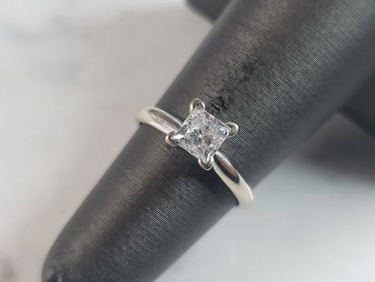 Womens Vintage Estate 14k White Gold Diamond Engagement Ring: A WOMENS 14K WHITE GOLD DIAMOND ENGAGEMENT RING. THE RING WEIGHS 2.1g, AND IS A SIZE 4.5. THE CENTER STONE IS ABOUT .69cts. RING IS MARKED "14k, .69". WOULD MAKE A GREAT GIFT FOR THAT SPECIAL SOMEONE.