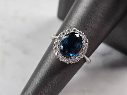 Womens Vintage Estate Sterling Silver Sapphire Colored Stone Ring: A WOMENS VINTAGE ESTATE STERLING SILVER RING WITH A SAPPHIRE COLORED STONE. NOT SURE IF THE STONE IS NATURAL OR MANMADE. THE RING WEIGHS 3.7g. THE SIZE OF THE RING IS A 7.0. THE LENGTH OF THE RING IS