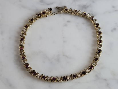 Vintage Estate 14k Gold Diamond & Amethyst Tennis Bracelet: A WOMENS VINTAGE ESTATE 14K GOLD DIAMOND & AMTHYST TENNIS BRACELET. BRACELET IS 7 1/2" LONG BY 3/16" WIDE, AND WEIGHS 10.8g. THERE ARE ABOUT .12cts OF DIAMONDS. BRACELET IS NT MARKED BUT IT HAS BEEN T