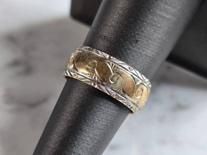 Womens Vintage Estate 14K Mixed Gold Etched Goldman Band Ring: A WOMENS VINTAGE ESTATE 14K MIXED ETCHED GOLD RING, MADE BY FREDERICK GOLDMAN. THE RING IS A SIZE 6.75 AND WEIGHS 6.1g. THE WIDTH OF THE RING IS ABOUT 5/16". RING IS MARKED" 14K, FG". THE RING MAKES A