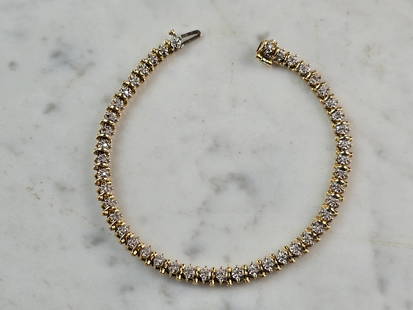 Womens Vintage Estate 14K Gold Diamond Tennis Bracelet: A WOMENS VINTAGE ESTATE 14K YELLOW GOLD DIAMOND TENNIS BRACELET. THE BRACELET MEASURES 7" LONG BY 1/8" WIDE, AND WEIGHS 11.7g. THERE ARE 45 TINY DIAMONDS IN THIS BRACELET. WOULD MAKE A GREAT GIFT FOR