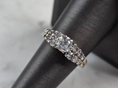 Womens Vintage Estate 14K White Gold Diamond Ring: A WOMENS ESTATE 14K WHITE GOLD DIAMOND RING. CENTER DIAMOND IS ABOUT .50cts, WITH A TOTAL OF ABOUT 1.1cts. THE RING WEIGHS 5.4g. THE SIZE OF THE RING IS AN 8.0. THE WIDTH OF THE RING IS 1/4". THIS MAK