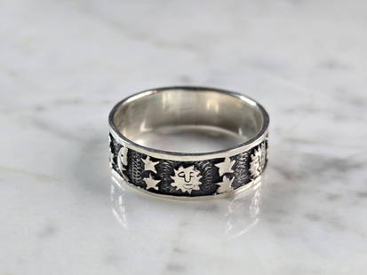 Womens Vintage Estate Sterling Silver Sun Stars & Moon Band Ring: A WOMENS VINTAGE ESTATE STERLING SILVER SUN, STARS AND MOON RING. RING IS A SIZE 13.75, AND WEIGHS 5.6g. THE WIDTH OF THE RING MEASURES ABOUT 5/16". THIS WOULD MAKE A NICE GIFT FOR THAT SOMEONE SPECIA