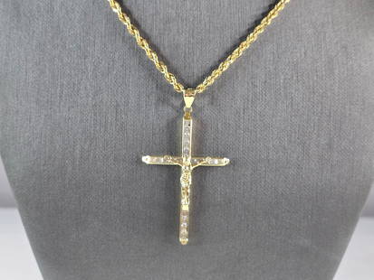 Vintage Estate 10k Gold Jesus Cross Pendant w/ Rope Necklace: A VINTAGE ESTATE 10K GOLD ROPE NECKLACE WITH A CZ JESUS CROSS PENDANT. TOGETHER THE CROSS AND NECKLACE WEIGHS 6.4g. THE PENDANT MEASURES 2 1/4" BY 1 1/4". THE NECKLACE MEASURES 26" LONG BY 1/8" WIDE.