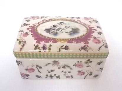 DECORATIVE VICTORIAN ART NOUVEAU PORCELAIN VANITY BOX: FOR SALE IS THIS NICE DECORATIVE VICTORIAN OR ART NOUVEAU STYLE PORCELAIN VANITY BOX WITH FLORAL DECORATION AND CHERUBS. BOX MEASURES 3" TALL BY 5 3/4" LONG BY 3 3/4" WIDE. SHIPPING AND HANDLING IS $2