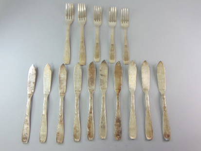Lot of  Silver Plated Fish Knifes & Forks by Christofle: FOR SALE IS THIS LOT OF FRENCH ANTIQUE SILVER PLATED FISH KNIFES & FORKS BY CHRISTOFLE. LOT IS MADE OF 10 FISH KNIFES THAT MEASURE 8 1/8" ON LENGTH AND 2 FORKS THAT MEASURE 7 3/8" IN LENGTH AND 3 FORK