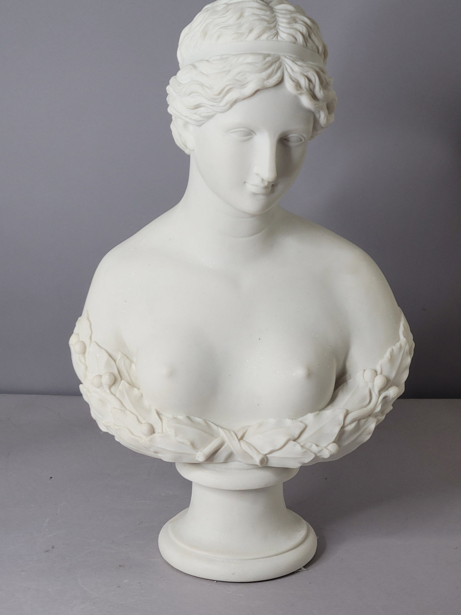 VICTORIAN STYLE BUST OF NUDE GREEK WOMAN: AN AMAZINGLY DECORATIVE AND HIGH QUALITY VICTORIAN BUST STATUE OF A GREEK NUDE WOMAN. THE STATUE STANDS 23" TALL BY 14" WIDE. STATUE IS MADE OF RESIN WITH A MARBLE LIKE FINISH. GREAT PIECE TO ADD TO T