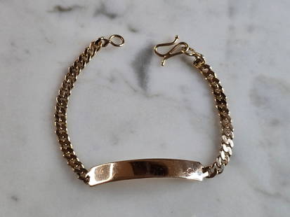 Womens Vintage Estate 14k Yellow Gold ID Bracelet: A WOMENS VINTAGE ESTATE 14K YELLOW GOLD ID BRACELET. THE BRACELET MEASURES 5 3/8" LONG BY 1/4" AND WEIGHS 4.9g. THE ID BAR MEASURES ABOUT 1 1/8" LONG. BRACELET IS NOT STAMPED, BUT HAS BEEN TESTED AND
