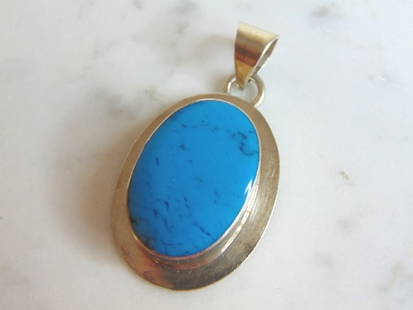Womens Vintage Estate Sterling Silver Turquoise Pendant: FOR SALE IS THIS WOMENS VINTAGE ESTATE STERLING SILVER TURQUOISE COLORED PENDANT . NOT SURE IF STONE IS REAL OR MAN MADE. PENDANT WEIGHS 12.3g AND PENDANT MEASURES 1 3/4" LONG BY 1" WIDE. MAKES A GREA