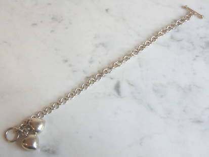 Womens Vintage Sterling Silver Heart Charm Bracelet: FOR SALE IS A LOVELY VINTAGE ESTATE .925 STERLING SILVER HEART CHARM BRACELET. BRACELET MEASURES 8 3/8" LONG BY 1/4" WIDE AND WEIGHS 23g. THIS WOULD MAKE A LOVELY GIFT FOR THAT SOMEONE SPECIAL. ANY QU