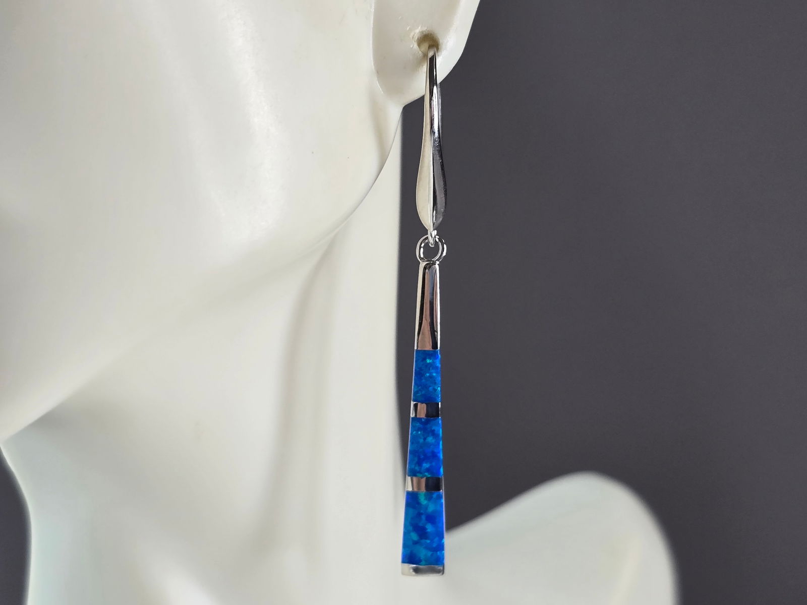 Womens Estate Sterling Silver Modernist Blue Opal Earrings: A PAIR OF WOMENS STERLING SILVER MODERNIST BLUE OPAL COLORED EARRINGS THAT WEIGH 5.0g AND MEASURES 2" LONG BY 3/16" WIDE. NOT SURE IF STONES ARE REAL OR MAN MADE. ANY QUESTIONS, PLEASE DO NOT HESITATE