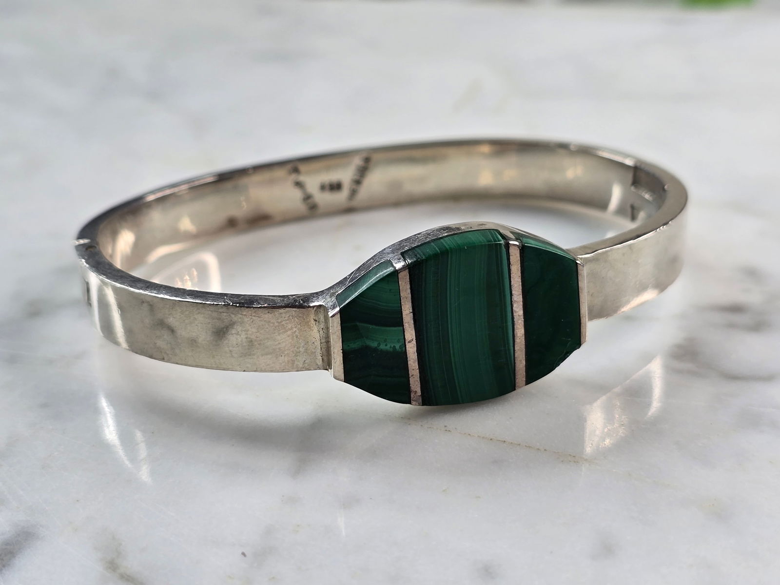 Womens Vintage Sterling Silver Malachite Bracelet: FOR SALE IS THIS WONDERFUL WOMENS VINTAGE ESTATE STERLING MALACHITE BRACELET. THE BRACELET WEIGHS 49.5g AND IS ABOUT 3/4" WIDE. THE CIRCUMFERENCE WITH THE GAP IS 6 3/8". ANY QUESTIONS PLEASE DO NOT HE