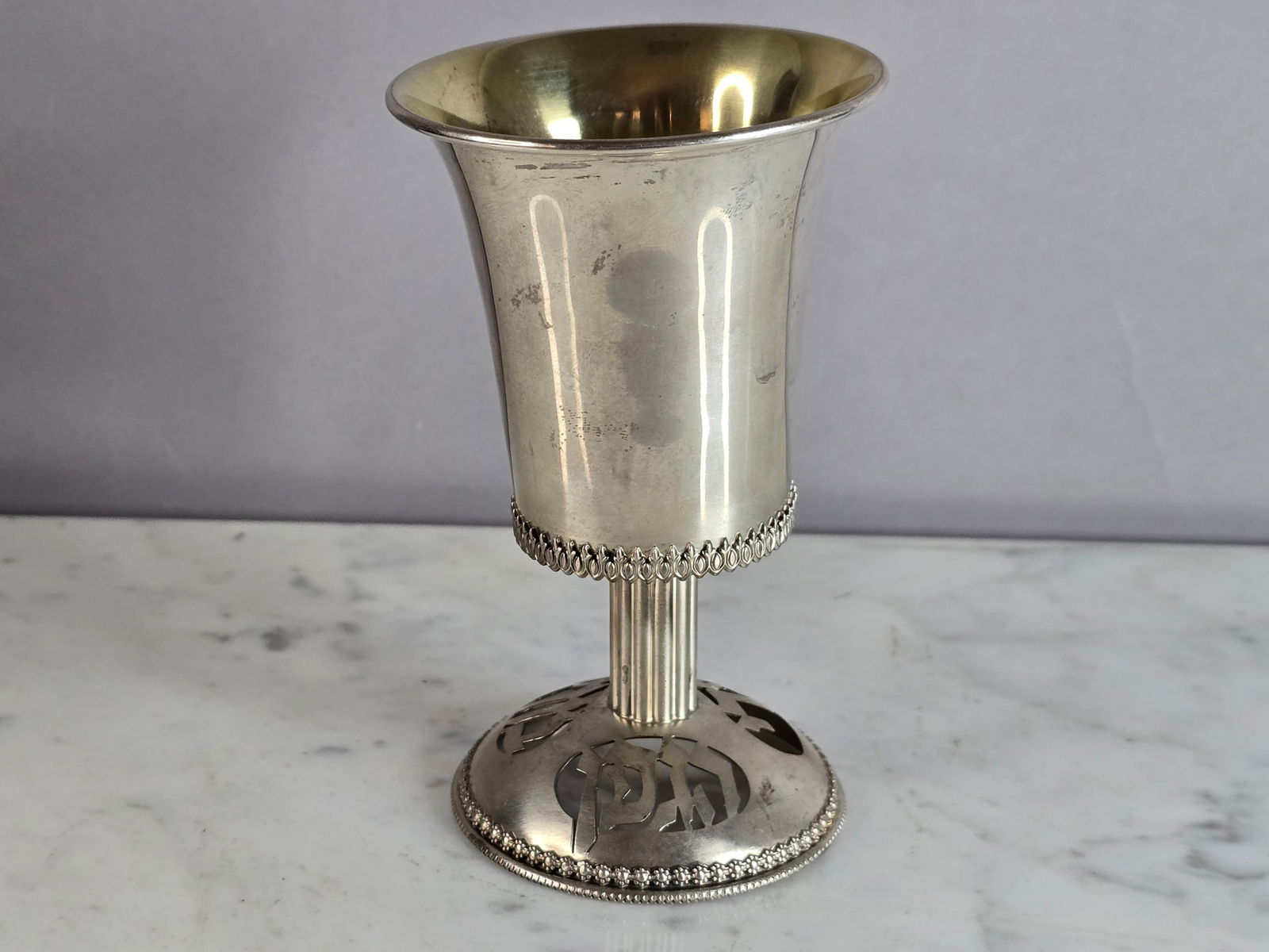 Vintage Jewish Judaica Sterling Silver Netafim Shabbat Kiddush Cup: This vintage Jewish Judaica sterling silver religious shabbat cup made by Netafim. The cup has a beautiful design and was likely used for religious ceremonies. It's made of sterling silver and has int