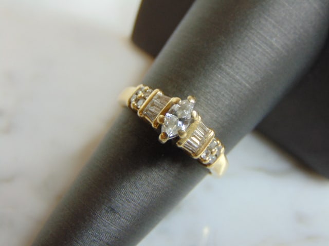 Womens Vintage Estate 14k Gold Diamond Ring: FOR SALE IS THIS LOVELY VINTAGE 14K YELLOW GOLD RING WITH A TOTAL OF ABOUT .58cts OF DIAMONDS. THE TOTAL WEIGHT IS 3.8g, AND IS A SIZE 7.0. THE MARQUISE IS ABOUT .25cts. RING IS MARKED 14K ON THE INSI