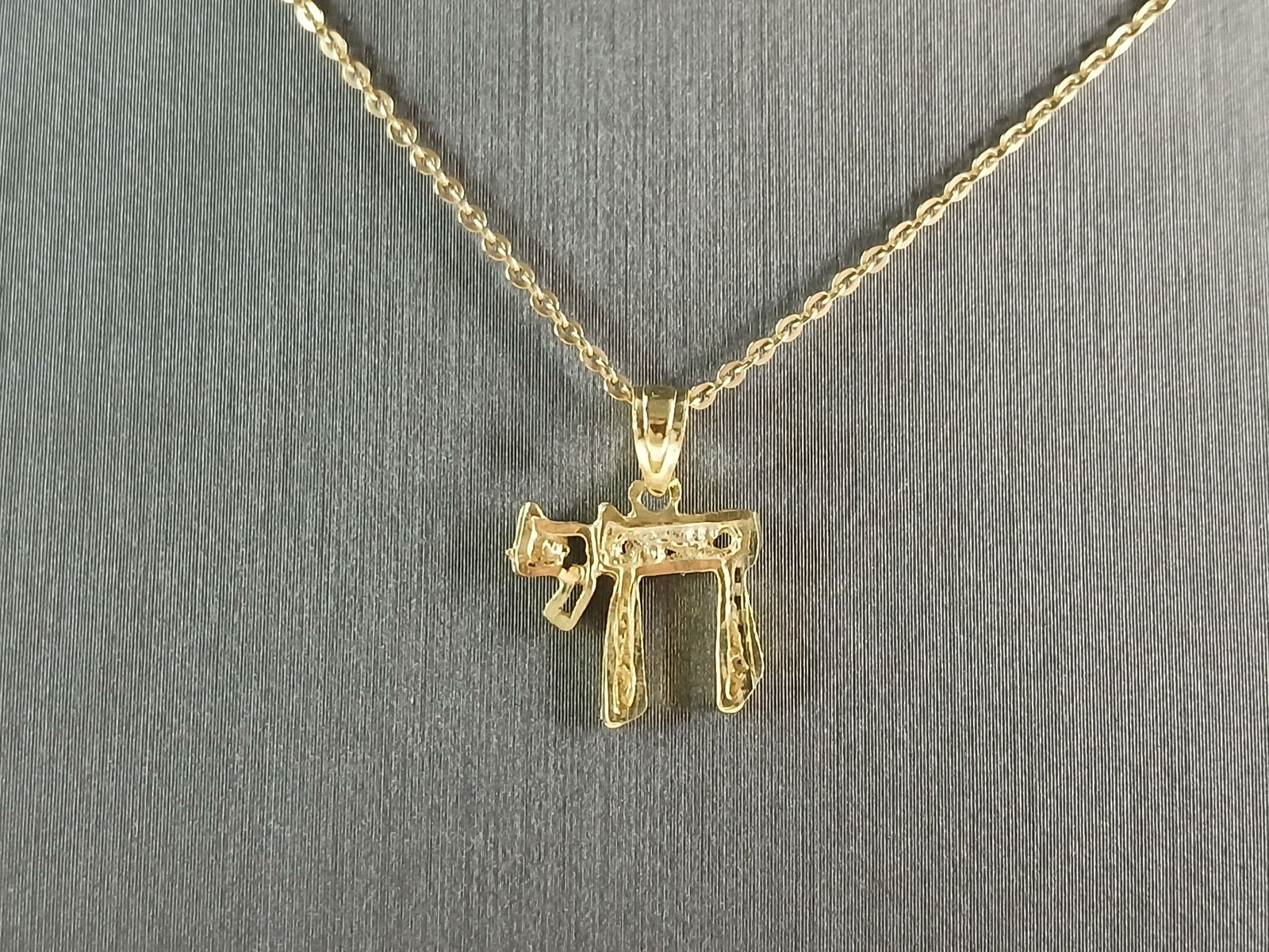 Womens Sterling Silver Gold Tone Jewish Hebrew Chai Pendant Necklace: A STERLING SILVER GOLD TONE JEWISH HEBREW CHAI OR LIFE PENDANT WITH NECKLACE. PENDANT WITH THE NECKLACE WEIGHS 2.1g. PENDANT MEASURES 1/2" LONG BY 1/2" WIDE, AND THE NECKLACE MEASURES 18" LONG, ADJUST