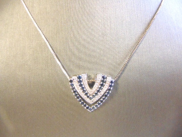 Women's Sterling Silver Necklace W/ CZ Stones: THIS IS A WOMENS STERLING SILVER NECKLACE WITH CZ DIAMONDS. THE NECKLACE MEASURES 18" LONG AND THE PENDANT MEASURES 7/8". TOGETHER THEY WEIGH 10.8g. ANY OTHER QUESTIONS PLEASE ASK. BE SURE TO CHECK OU