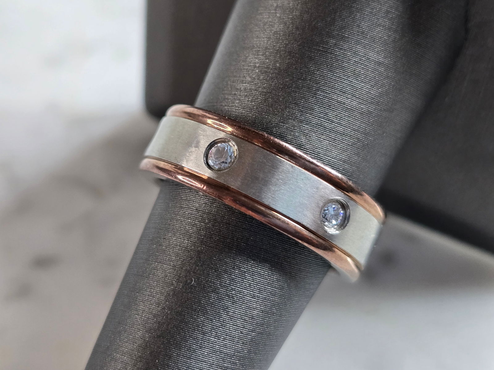 Mens Estate Stainless Steel Wedding Band Ring: A MENS ESTATE STAINLESS STEEL WEDDING BAND RING. THE RING IS A SIZE 9.0 AND IS ABOUT 1/4" WIDE. STONES ARE CZ. ANY QUESTIONS PLEASE DONT HESITATE TO ASK. BE SURE TO CHECK OUT SOME OF MY OTHER GREAT IT