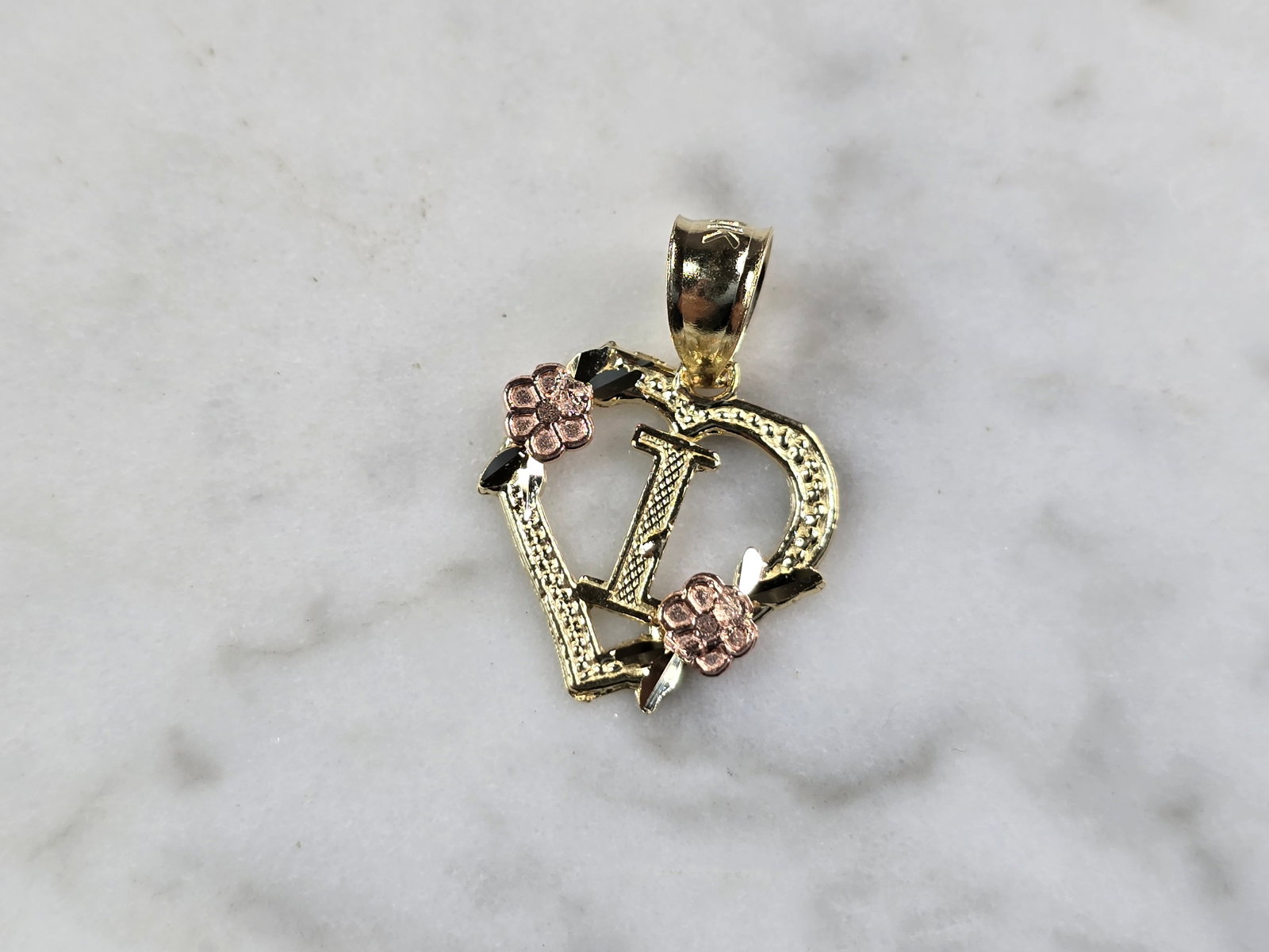 Womens 10K Yellow & Rose Gold Initial Letter " I " Heart Pendant: A WOMENS 10K YELLOW & ROSE GOLD "I" HEART PENDANT. PENDANT MEASURES 3/4" LONG BY 5/8" WIDE. TOTAL WEIGHT OF THE PENDANT IS 0.9g. WOULD MAKE A LOVELY GIFT FOR THAT SOMEONE SPECIAL. ANY QUESTIONS PLEASE