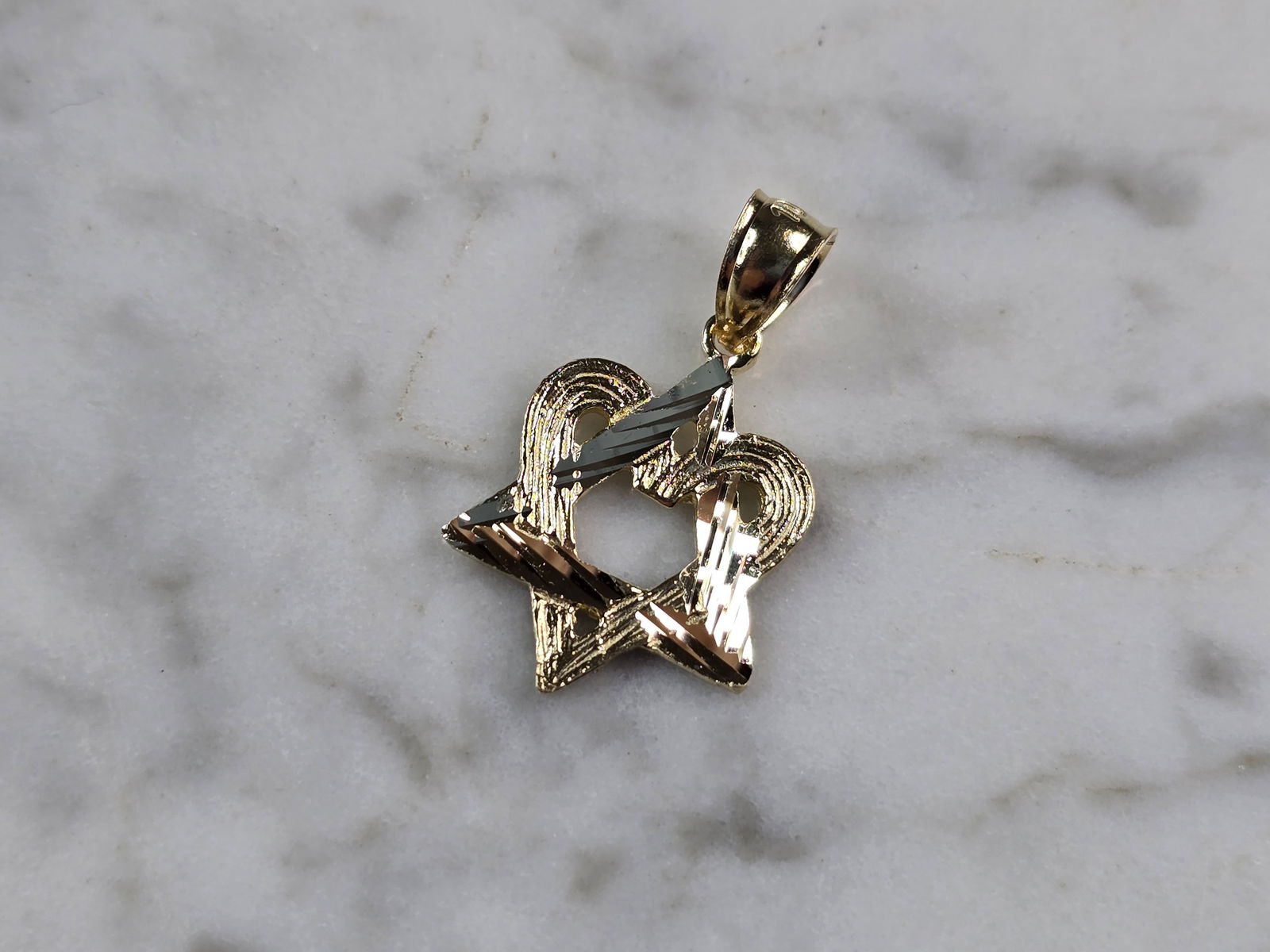 Womens 10k Yellow Gold Jewish Judaica Star of David Heart Pendant: A WOMENS 10k YELLOW GOLD MODERNIST STAR OF DAVID HEART PENDANT. THE PENDANT WEIGHS 1.2g, AND MEASURES 7/8" LONG BY 5/8" WIDE. MAKES A GREAT GIFT FOR THAT SOMEONE SPECIAL. ANY QUESTIONS, PLEASE ASK. BE