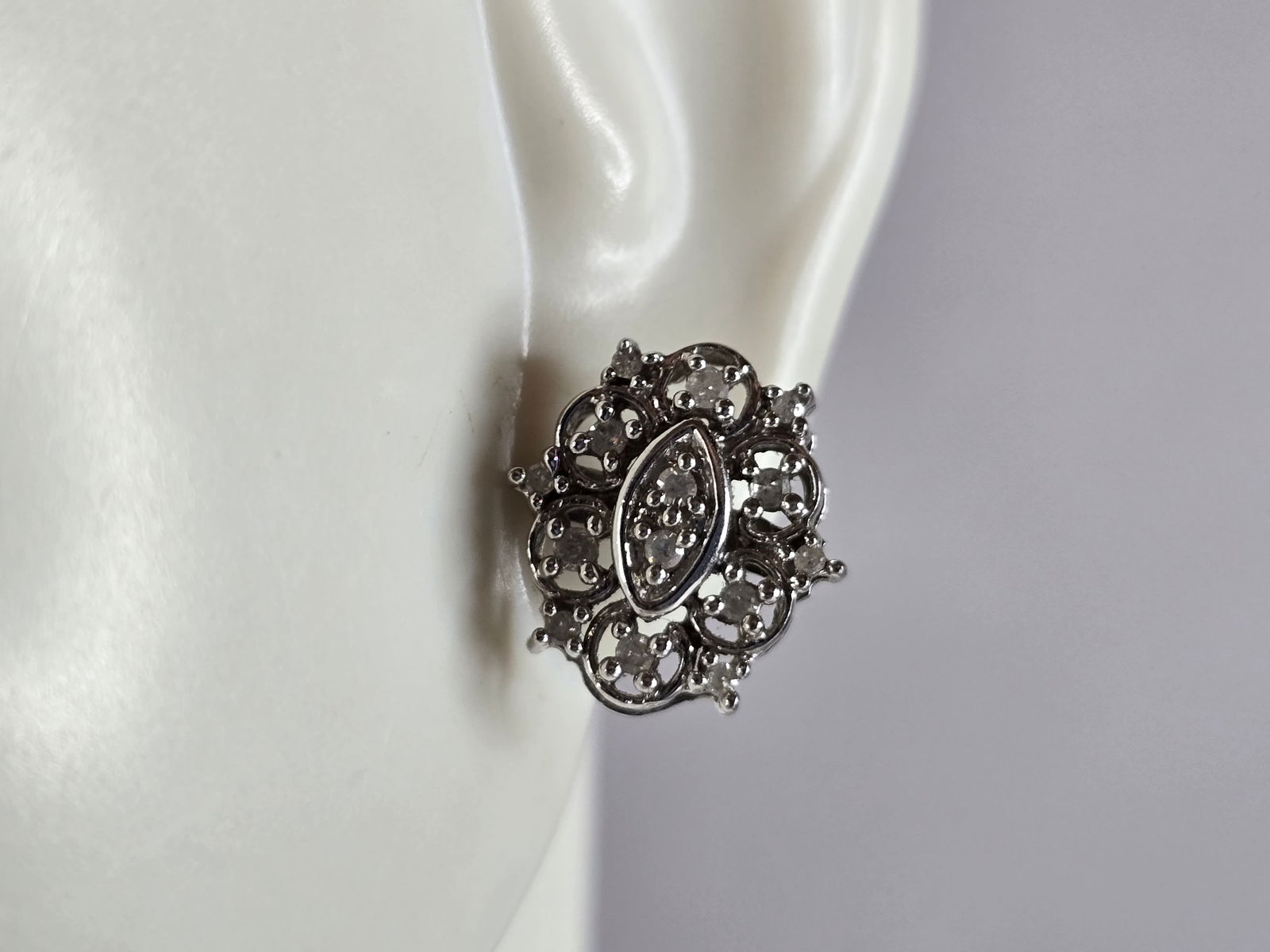 Pr Womens Vintage Estate 10K White Gold Diamond Stud Earrings: A PAIR OF WOMENS VINTAGE ESTATE 10K WHITE GOLD DIAMOND STUD EARRINGS. THE EARRINGS WEIGH 2.9g, AND MEASURE 1/2" LONG BY 3/8" WIDE. THERE ARE ABOUT 0.25cts OF DIAMONDS. MARKED 10K ON THE STEMS. THIS MA