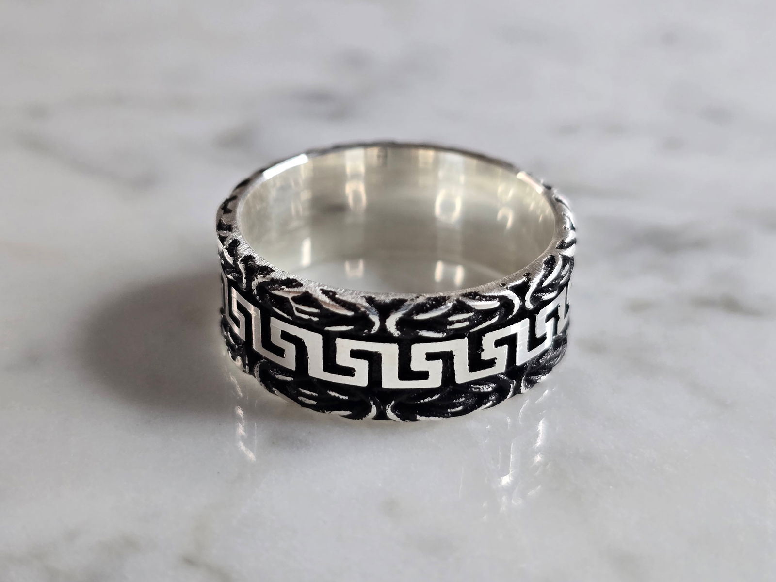 Mens Estate Sterling Silver Greek Key Band Ring: A MENS ESTATE STERLING SILVER GREEK KEY BAND RING. THE RING WEIGHS 8.2g AND IS A SIZE 11.0. BAND MEASURES 3/8" WIDE. THIS RING WOULD BE A WONDERFUL GIFT FOR THAT SPECIAL SOMEONE. ANY QUESTIONS PLEASE