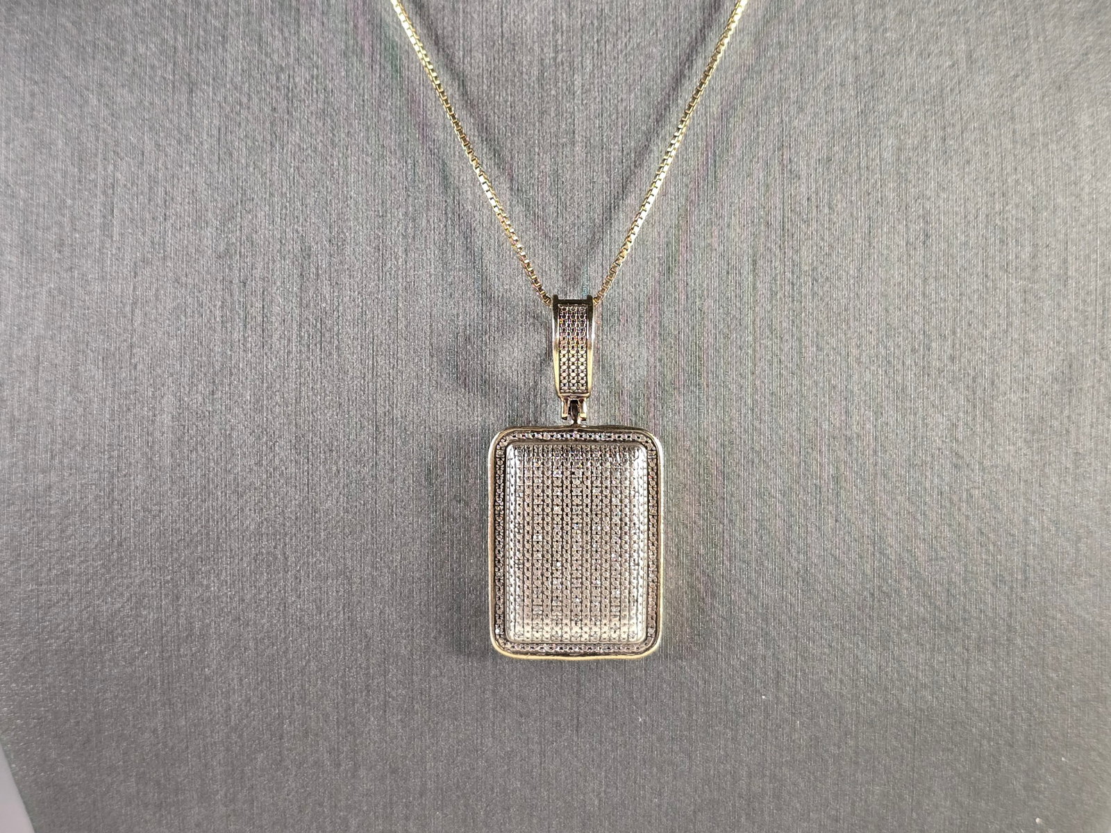 Womens Estate Sterling Silver & 14KGP Diamond Pendant Necklace: A WOMENS VINTAGE ESTATE STERLING SILVER & 14KGP DIAMOND MODERNIST PENDANT WITH NECKLACE THAT WEIGHS 8.3g. THE NECKLACE MEASURES 16" LONG, AND THE PENDANT MEASURES 1 1/2" LONG BY 3/4" WIDE. ANY QUESTIO