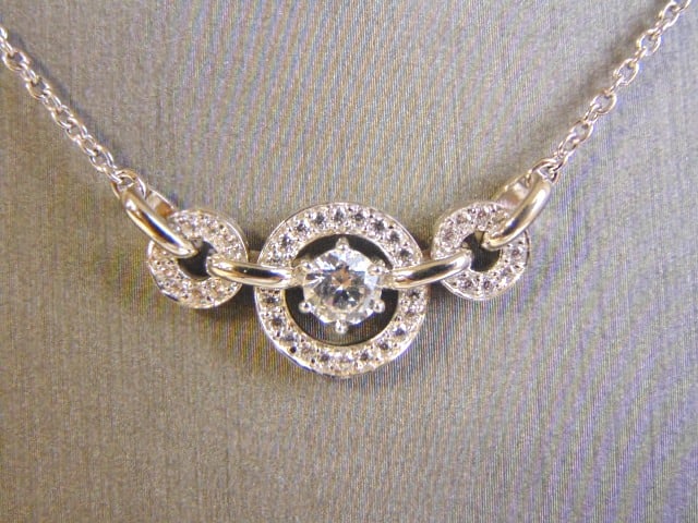 Womens Sterling Silver CZ Stones Pendant W/ Necklace: FOR SALE IS THIS WOMENS VINTAGE ESTATE .925 STERLING SILVER CZ STONES PENDANT WITH NECKLACE. NOT SURE IF STONES ARE REAL OR MAN MADE. TOGETHER NECKLACE AND PENDANT WEIGHS 5.2g AND PENDANT MEASURES 3/8