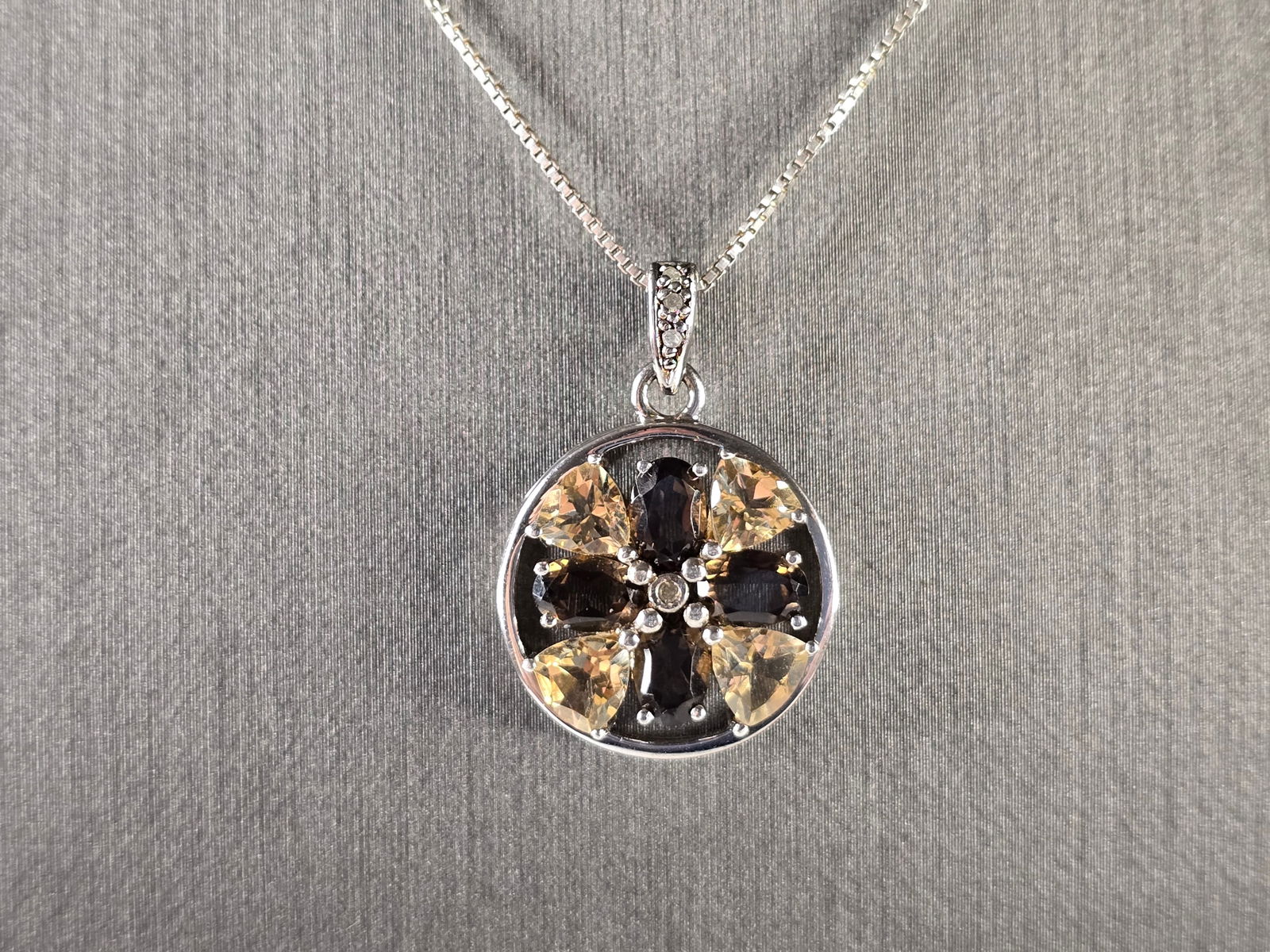 Womens Vintage Estate Sterling Silver Smoky Quartz Pendant Necklace: A WOMENS VINTAGE ESTATE GOLD TONE STERLING SILVER SMOKY QUARTZ AND CITRINE PENDANT WITH NECKLACE. THE TOTAL WEIGHT IS 6.0g. PENDANT MEASURES 1" LONG BY 3/4" WIDE, AND NECKLACE IS 18" LONG. NOT SURE IF