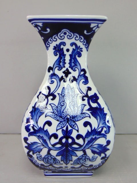 Decorative Chinese Porcelain Lotus Floral Cobalt Vase: THIS BEAUTIFUL DECORATIVE CHINESE PORCELAIN COBALT FLORAL COVERED VASE MEASURES ABOUT 10 1/8" TALL BY ABOUT 6" AT ITS WIDEST POINT. HAS A GREAT DECORATIVE LOOK AND IS OF GREAT QUALITY. WOULD MAKE