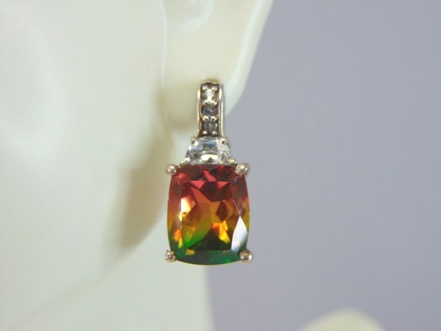 Womens Vintage Sterling Silver Modernist Earrings: A PAIR OF WOMENS STERLING SILVER MODERNIST EARRINGS. NOT SURE OF WHAT THE STONES ARE AND IF STONES ARE REAL OR MAN MADE. EARRINGS WEIGH 5.2g AND MEASURES 3/4" LONG BY 3/8" WIDE. ANY OTHER QUESTIONS, P