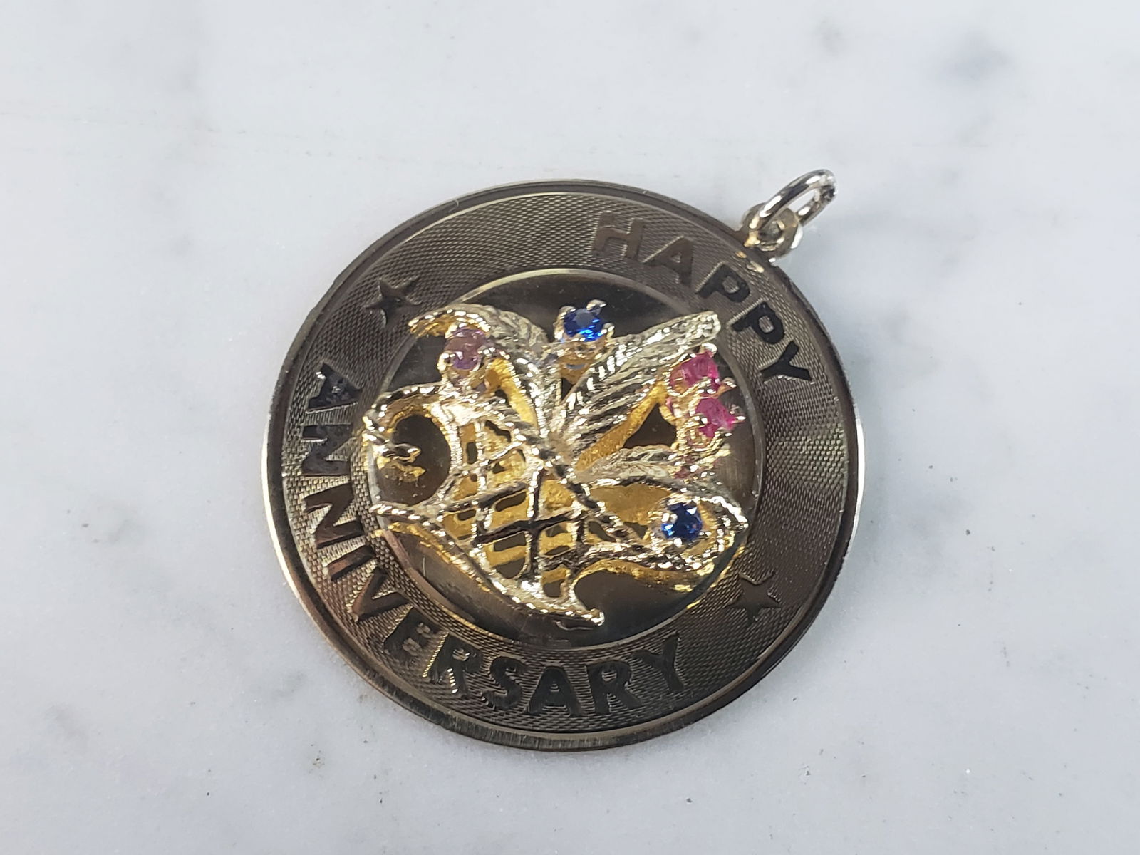 Womens Vintage Estate 14K Yellow Gold Anniversary Pendant: A WOMENS VINTAGE ESTATE 14k GOLD ANNIVERSARY PENDANT WITH THREE DIFFRENT BIRTHSTONES. PENDANT WEIGHS 6.3g, AND MEASURES 1 1/4" LONG BY 1 1/4" WIDE. AS YOU CAN SEE IT IS PERSONALIZED ON THE BACK, BUT C