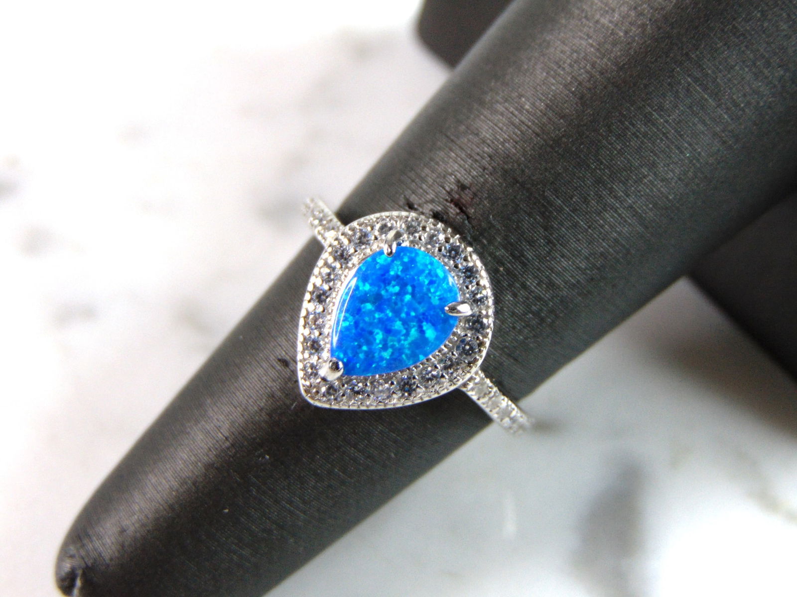 Womens Estate Sterling Silver Modernist Blue Opal Ring: A WOMENS ESTATE STERLING SILVER MODERNIST OPAL COLORED RING. THE RING IS A SIZE 6.0 AND WEIGHS 2.9g. NOT SURE IF STONE IS NATURAL OR MAN MADE. THE RING MAKES A BEAUTIFUL GIFT FOR THAT SOMEONE SPECIAL.