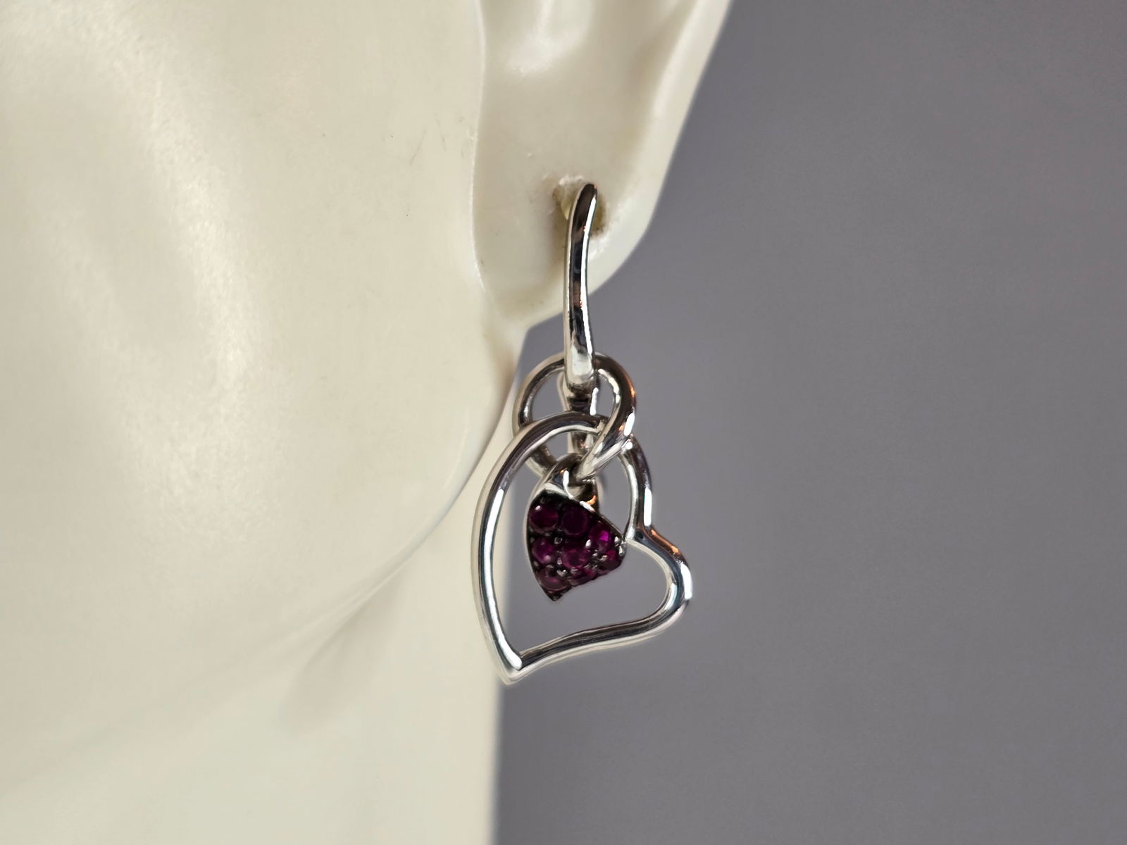 Womens Estate Sterling Silver Amethyst Colored Heart Earrings: A PAIR OF WOMENS ESTATE STERLING SILVER AMETHYST COLORED EARRINGS. EARRINGS WEIGH 2.7g, AND MEASURE 1" LONG BY 1/2" WIDE. ANY QUESTIONS, PLEASE DO NOT HESITATE TO ASK. BE SURE TO CHECK OUT SOME OF MY