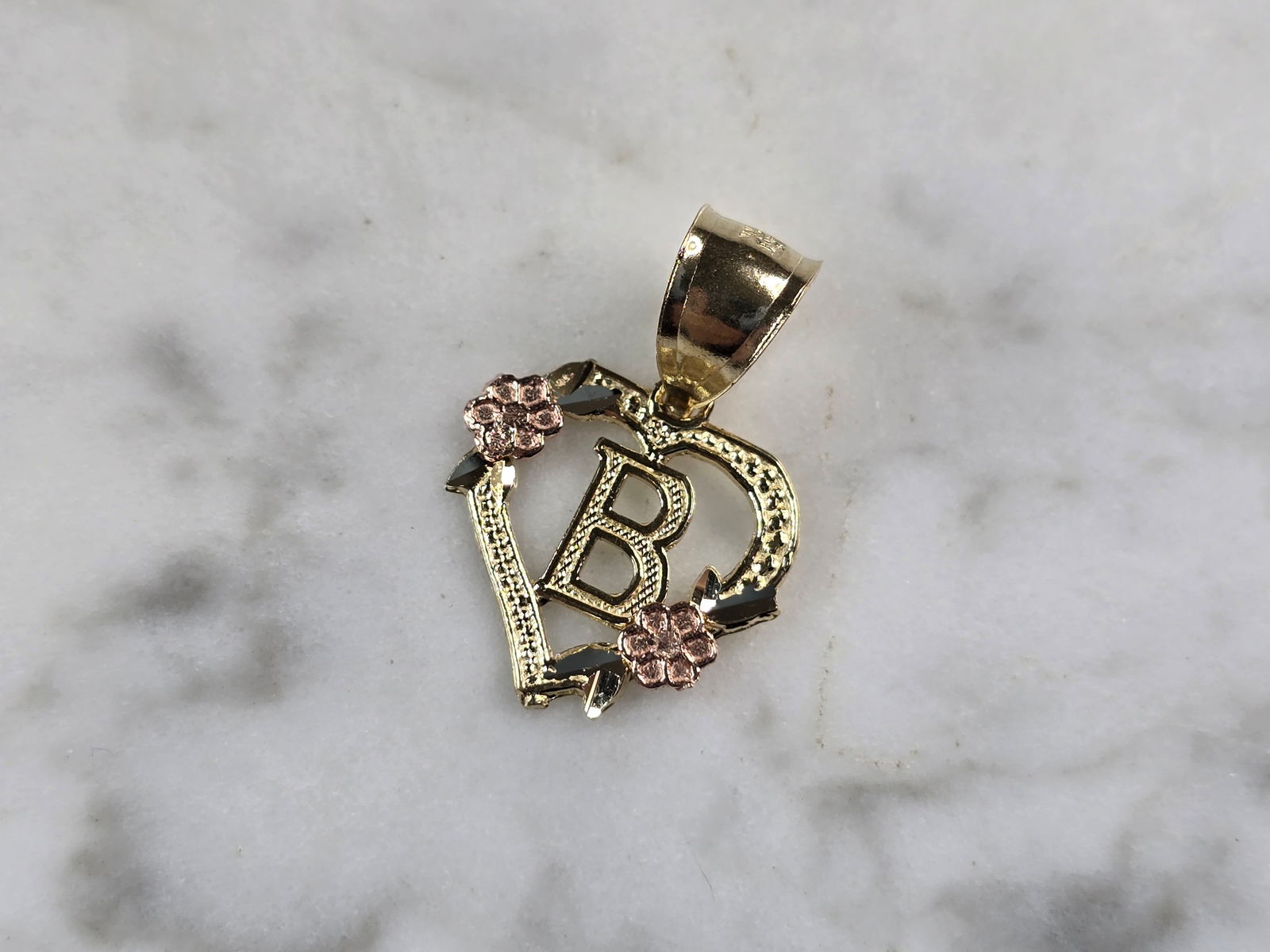 Womens 10K Yellow & Rose Gold Initial Letter " B " Heart Pendant: A WOMENS 10K YELLOW & ROSE GOLD "B" HEART PENDANT. PENDANT MEASURES 3/4" LONG BY 5/8" WIDE. TOTAL WEIGHT OF THE PENDANT IS 0.9g. WOULD MAKE A LOVELY GIFT FOR THAT SOMEONE SPECIAL. ANY QUESTIONS PLEASE