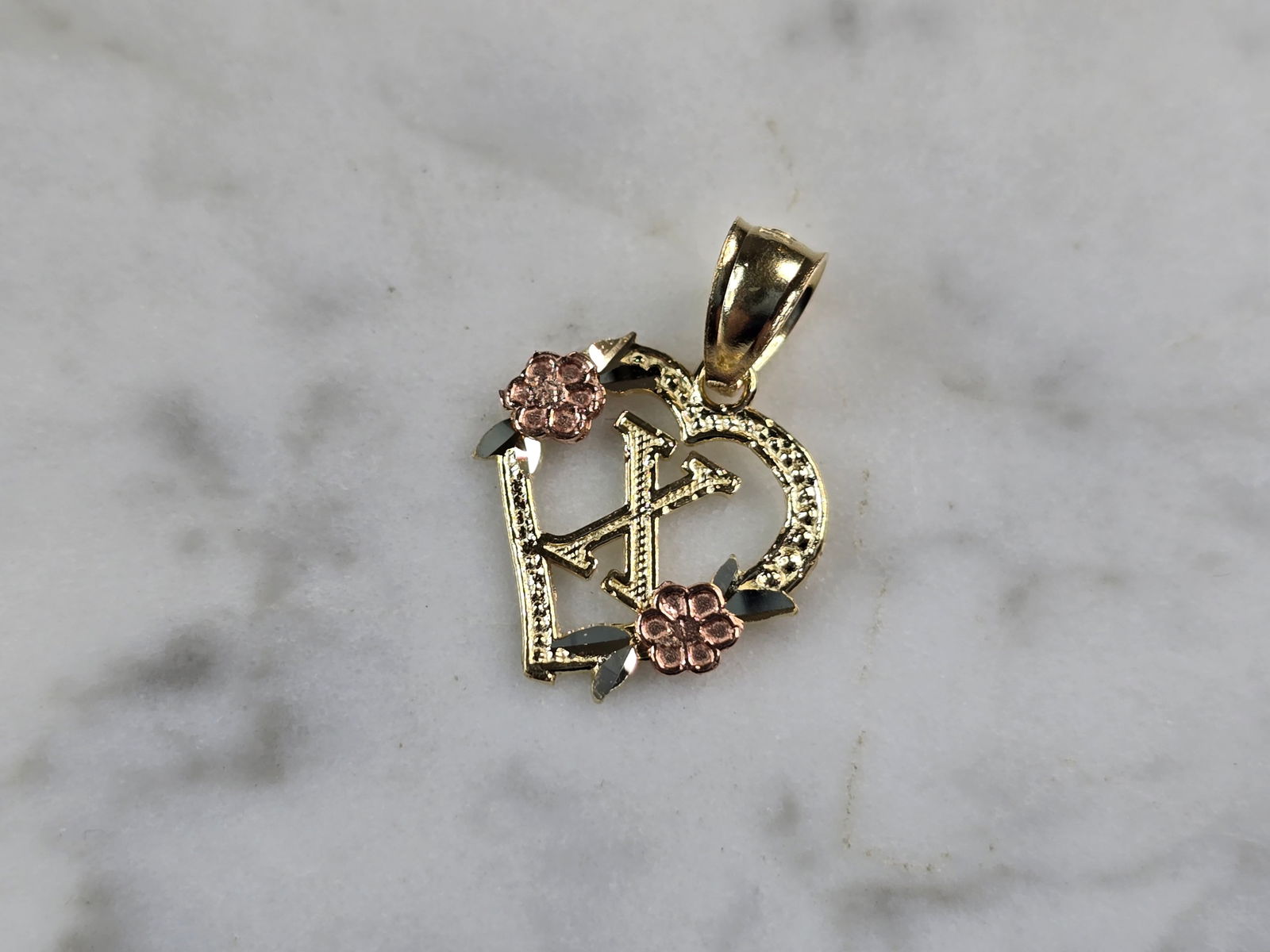 Womens 10K Yellow & Rose Gold Initial Letter " X " Heart Pendant: A WOMENS 10K YELLOW & ROSE GOLD "X" HEART PENDANT. PENDANT MEASURES 3/4" LONG BY 5/8" WIDE. TOTAL WEIGHT OF THE PENDANT IS 0.9g. WOULD MAKE A LOVELY GIFT FOR THAT SOMEONE SPECIAL. ANY QUESTIONS PLEASE