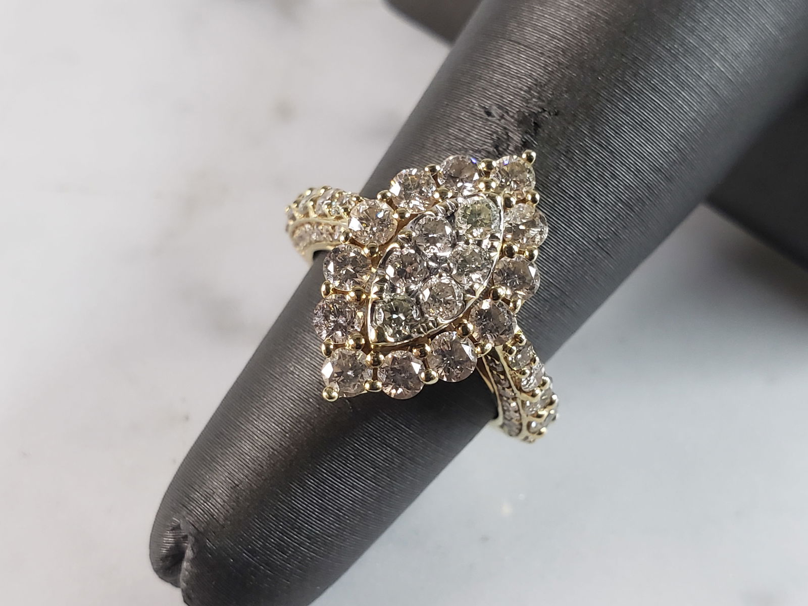 Womens Vintage Estate 14K Yellow Gold Diamond Ring: A WOMENS VINTAGE ESTATE 14K YELLOW GOLD DIAMOND RING WITH ABOUT 1.5cts OF DIAMONDS IN IT. THE RING WEIGHS 3.8g. THE SIZE OF THE RING IS A 4.25. RING IS NOT MARKED BUT IT HAS BEEN TESTED AND IS GUARANT