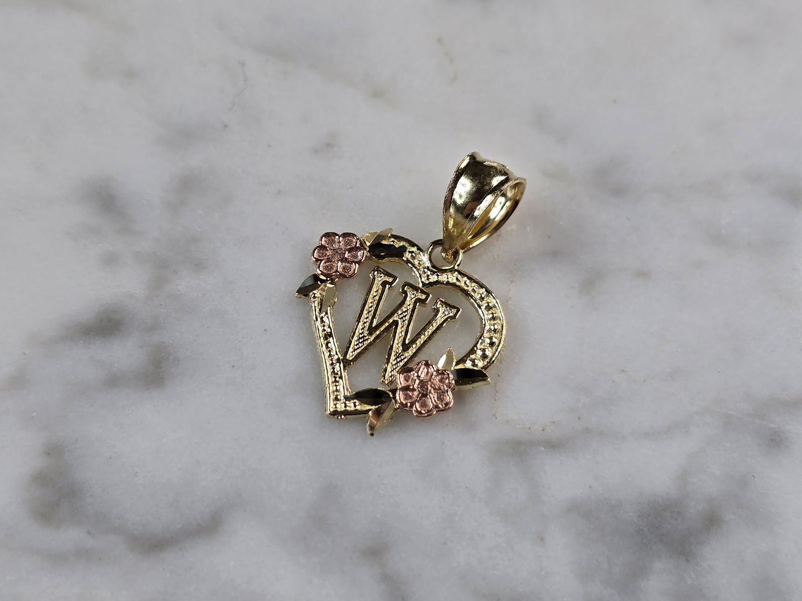 Womens 10K Yellow & Rose Gold Initial Letter " W " Heart Pendant: A WOMENS 10K YELLOW & ROSE GOLD "W" HEART PENDANT. PENDANT MEASURES 3/4" LONG BY 5/8" WIDE. TOTAL WEIGHT OF THE PENDANT IS 0.9g. WOULD MAKE A LOVELY GIFT FOR THAT SOMEONE SPECIAL. ANY QUESTIONS PLEASE