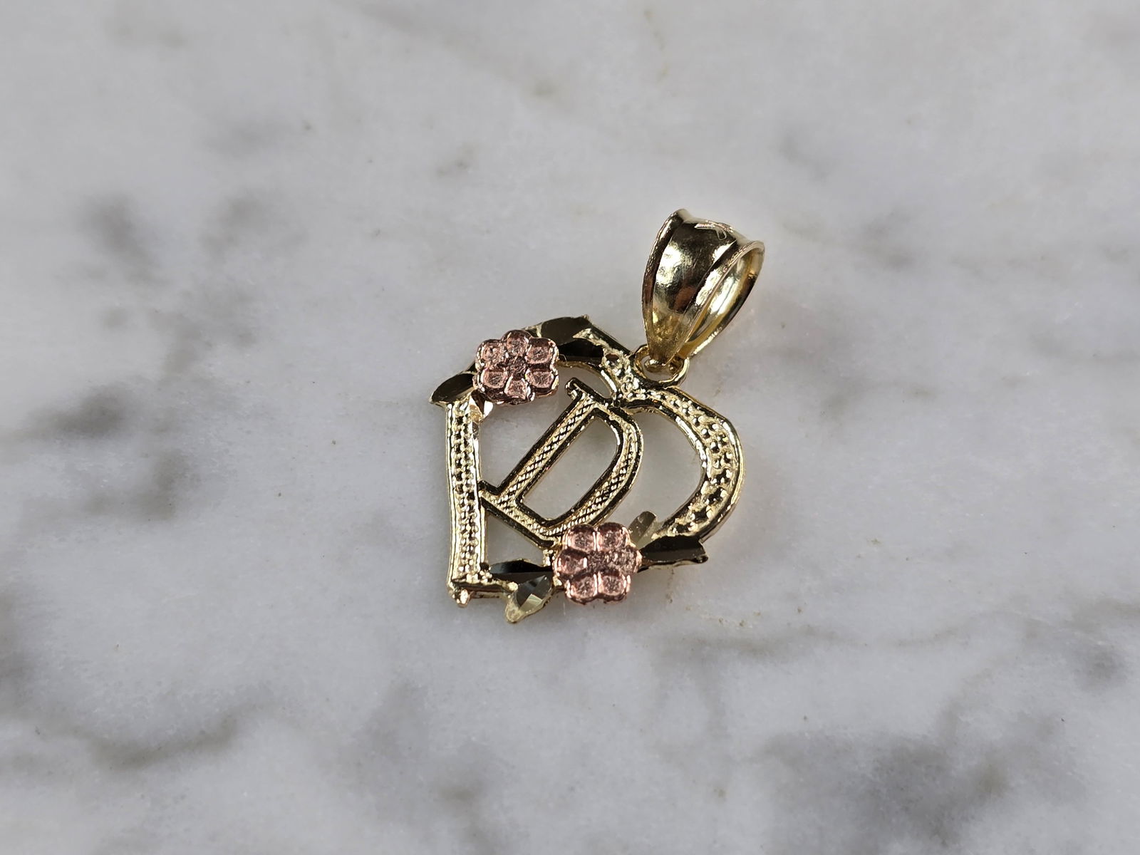 Womens 10K Yellow & Rose Gold Initial Letter " D " Heart Pendant: A WOMENS 10K YELLOW & ROSE GOLD "D" HEART PENDANT. PENDANT MEASURES 3/4" LONG BY 5/8" WIDE. TOTAL WEIGHT OF THE PENDANT IS 0.9g. WOULD MAKE A LOVELY GIFT FOR THAT SOMEONE SPECIAL. ANY QUESTIONS PLEASE