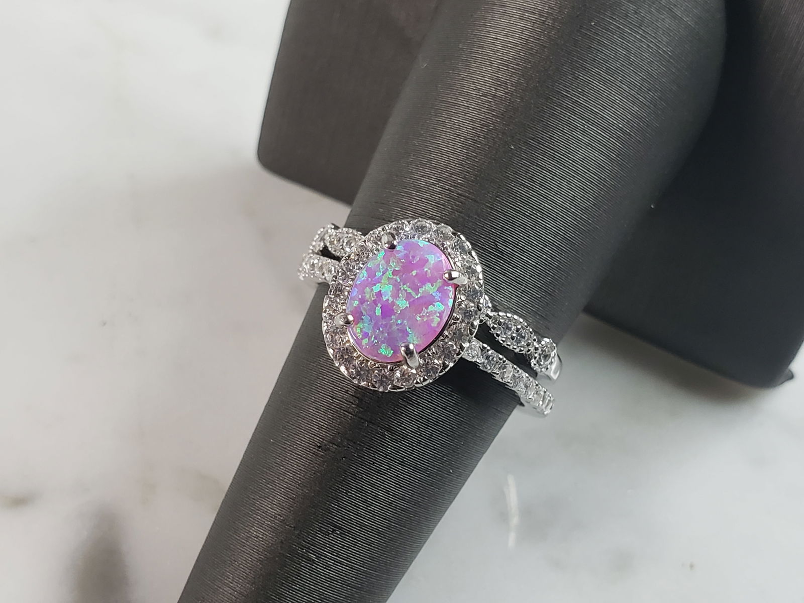 Womens Sterling Silver Pink Opal Stone Ring Set: A WOMENS STERLING SILVER PINK OPAL STONE RING SET. NOT SURE IF STONES ARE REAL OR MAN MADE. THE RINGS TOGETHER WEIGH 4.8g AND ARE A SIZE 6.0. FACE MEASURES 1/2". MAKES A GREAT GIFT FOR THAT SOMEONE SP