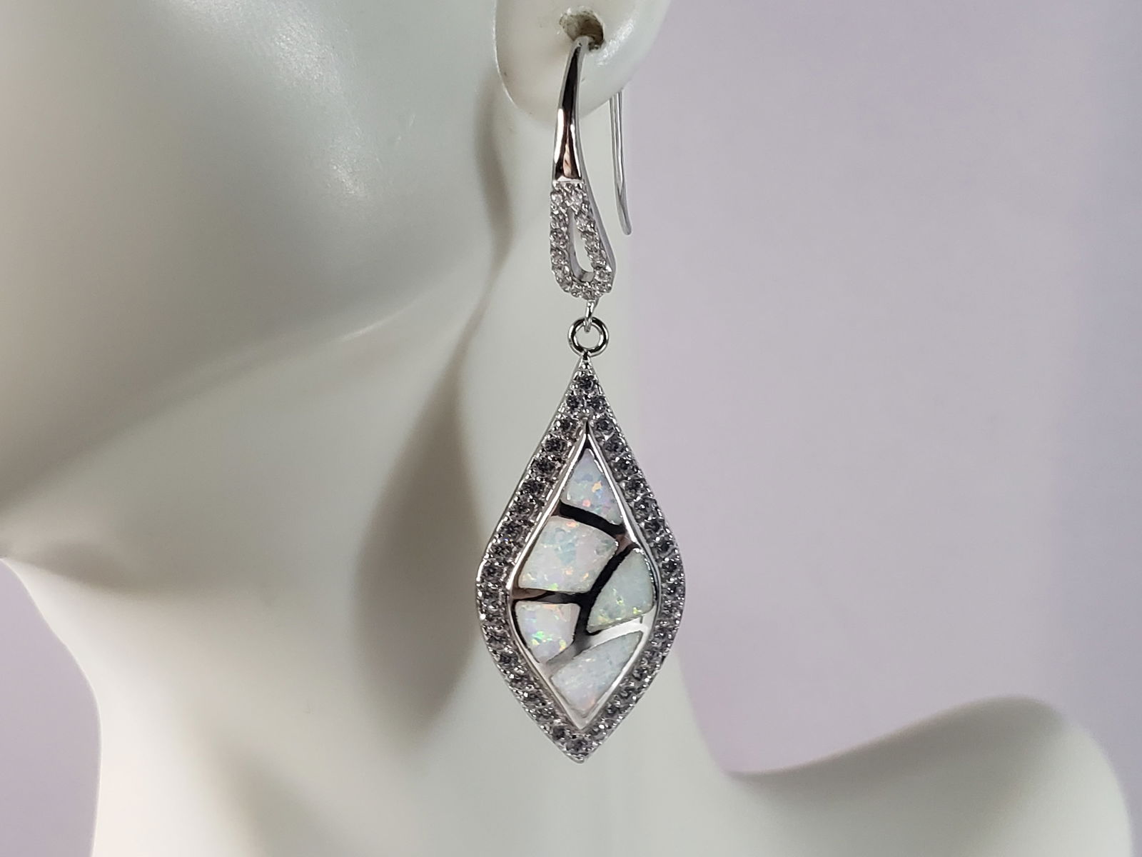 Womens Estate Sterling Silver Modernist Opal Earrings: A PAIR OF WOMENS STERLING SILVER MODERNIST OPAL COLORED EARRINGS THAT WEIGH 7.8g AND MEASURES 1 7/8" LONG BY 1/2" WIDE. NOT SURE IF STONES ARE REAL OR MAN MADE. ANY OTHER QUESTIONS, PLEASE DO NOT HESI
