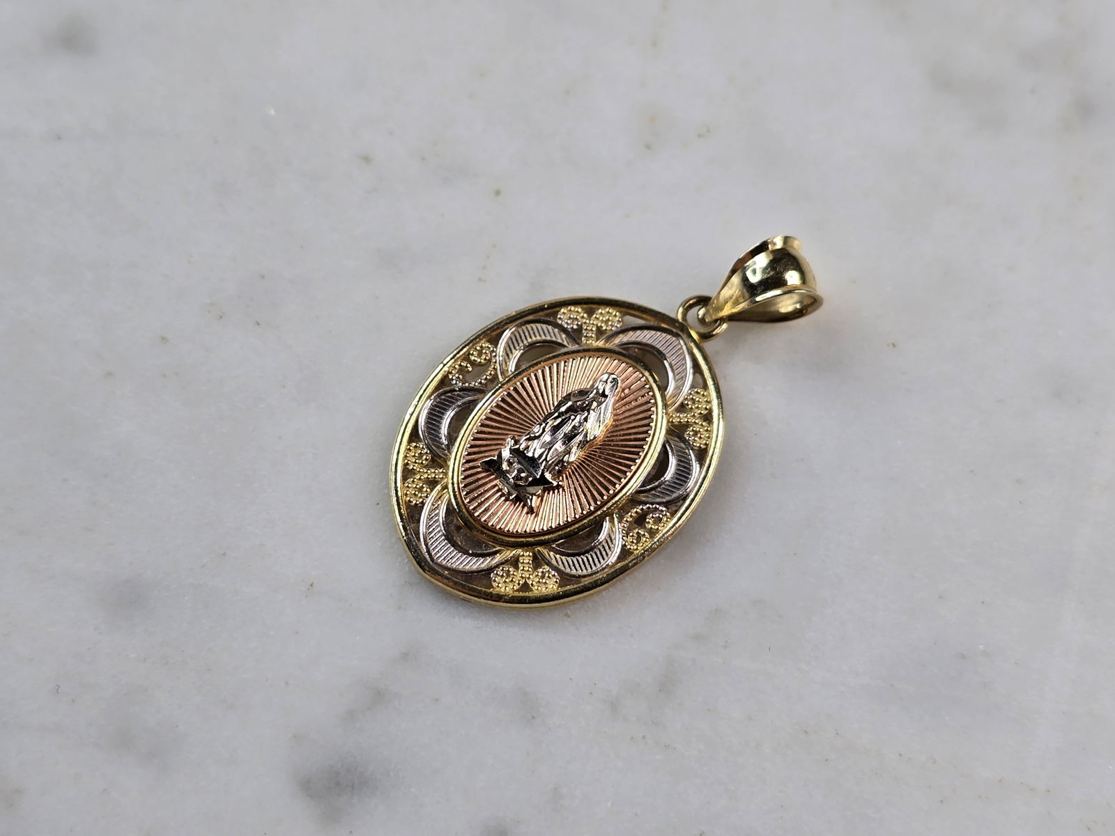 Womens Vintage Estate 14K Mixed Gold Religious Virgin Mary Pendant: A WOMENS VINTAGE ESTATE 14K MIXED GOLD RELIGIOUS VIRGIN MARY PENDANT THAT WEIGHS 2.0g. THE PENDANT MEASURES 1" LONG BY 5/8" WIDE. MAKES A GREAT GIFT FOR THAT SPECIAL SOMEONE.