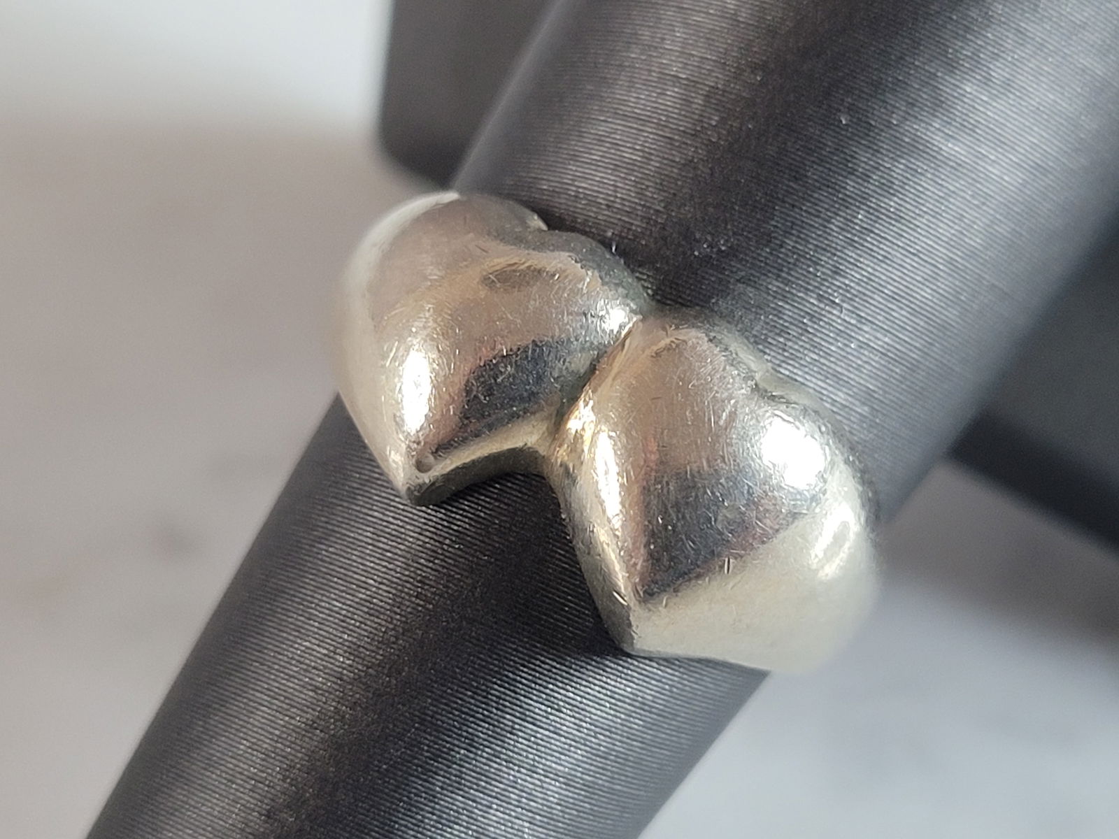 Womens Vintage Estate Sterling Silver Double Heart Ring: A WOMENS VINTAGE ESTATE STERLING SILVER DOUBLE HEART RING. THE RING SIZE IS A 8.0, AND WEIGHS 4.9g. THE WIDTH OF THE RING IS 3/8". WOULD MAKE A NICE GIFT FOR THAT SOMEONE SPECIAL. ANY OTHER QUESTIONS